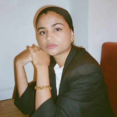 A square image depicting Aydha Mehnaz, Global Brand Relations Lead, Moynat